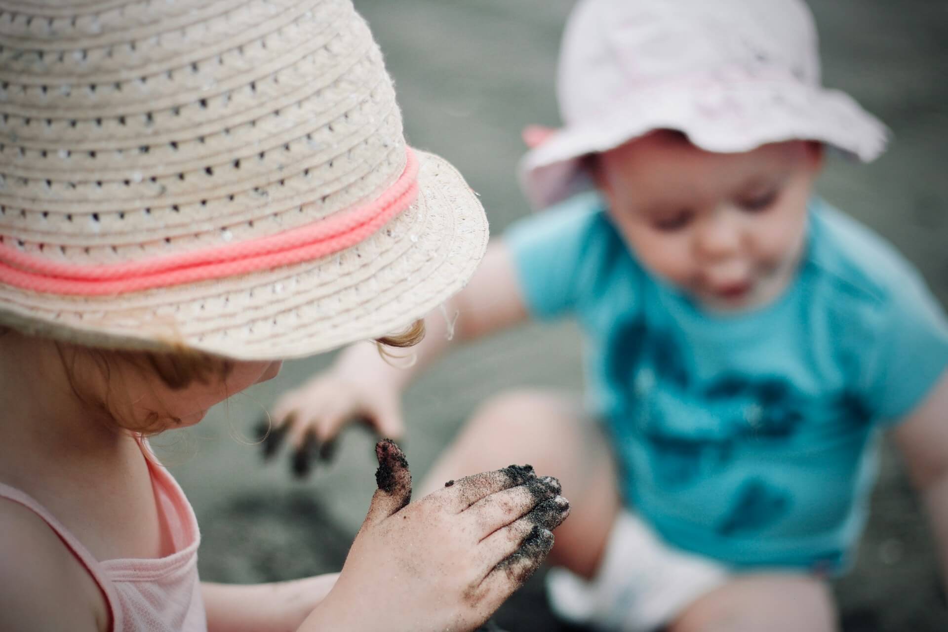 A young child exploring colourful learning materials
